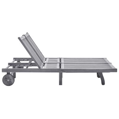 A silver-gray metal chaise lounger with an extendable backrest and wheels on the left side