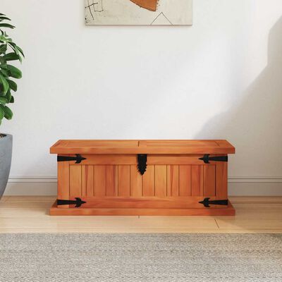 Wooden trunk with lid closed, front view showing hinges