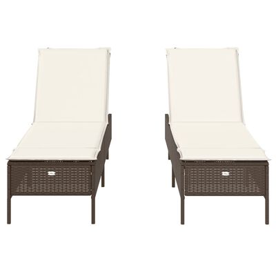Two brown wicker chaise lounges with cream cushions viewed from front