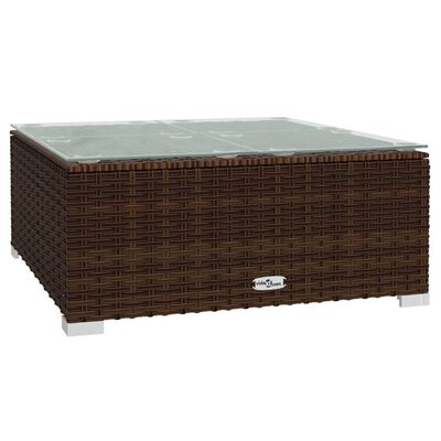 Brown wicker coffee table with glass top.