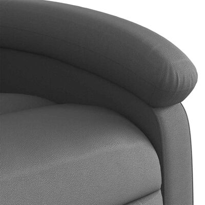Close-up of upholstery texture showing grey leather-like material.