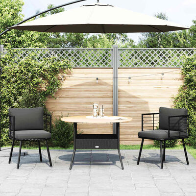 Patio scene with two chairs and a small round table with parasol.