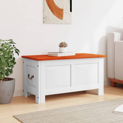 White storage bench with copper top and two-panel front, placed in living space with plant nearby.