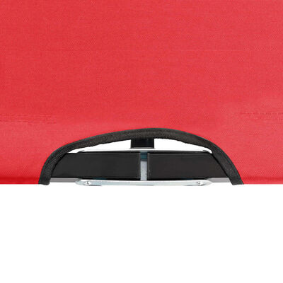 Close-up of fabric edge and carrying handle on red table