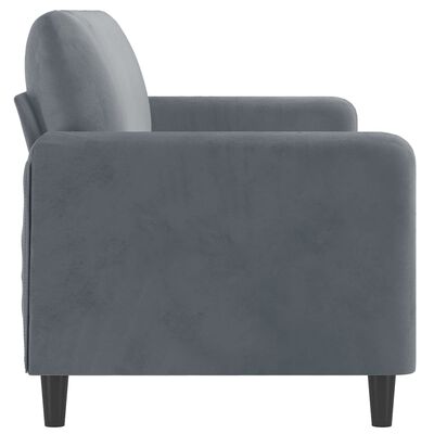 Close-up side view of a blue-gray armrest and backrest with rounded corners.