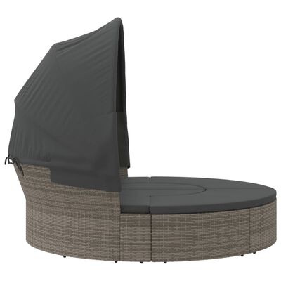 Outdoor daybed with canopy folded to the side showing round cushion seating