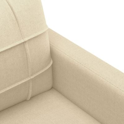 Close-up of interior armrest seam on beige upholstered chair showing stitching.