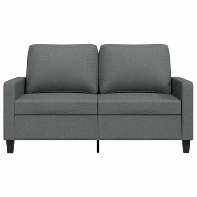 Side view of gray armchair showing back and armrest.