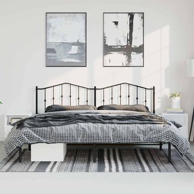 Black metal bed frame with two-piece headboard and checkered bedding in a bright room.