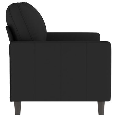 Close-up of black armchair side panel and armrest with stitching details