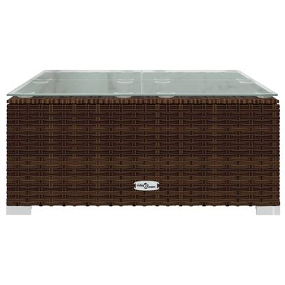 Large wicker coffee table with glass top and brand logo on front.