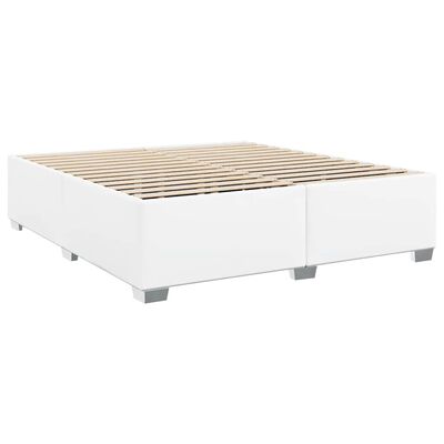 White platform bed frame with slatted wood base visible