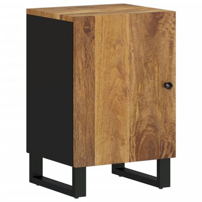 Close-up of a wooden cabinet door and black base, showing wood grain and knob.