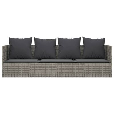 Straight outdoor wicker sofa with five back cushions and dark seat cushions.