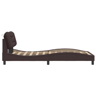 Side view of brown upholstered bed frame with curved profile and slats.