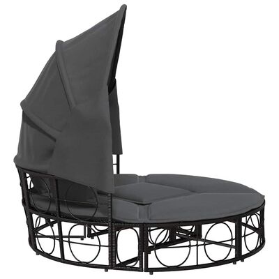 Side view of the round outdoor daybed showing back canopy and metal frame.