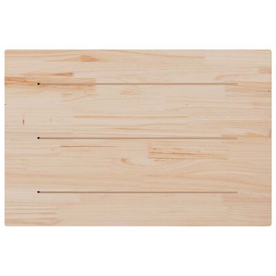 Back of a light wood cutting board with grooves/slots