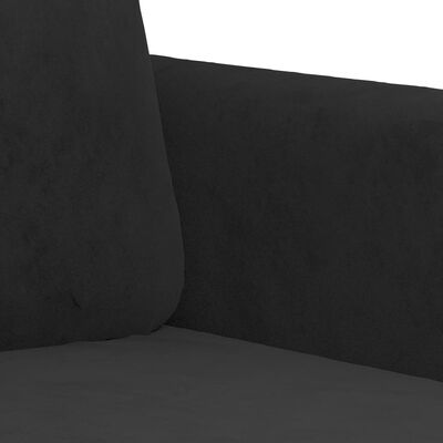 Close-up of black fabric upholstery on sofa arm and seat.