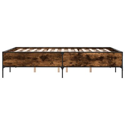 Wide view of bed frame showing two twin beds joined, dark wood panels and metal frame