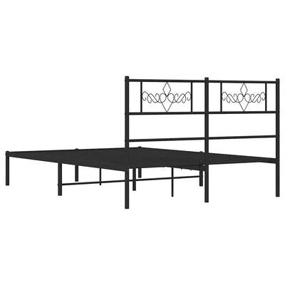 A partial view of a black metal bed frame with headboard and a couple of side rails visible; the bed is not fully assembled.
