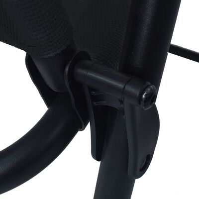 Close-up of the folding chair hinge/pivot mechanism.