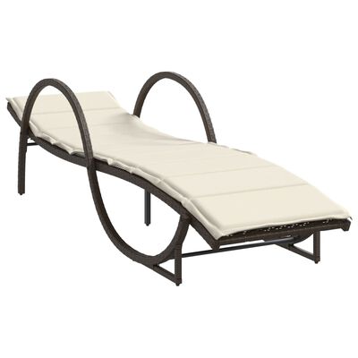 Single curved outdoor lounge chair with beige cushion.