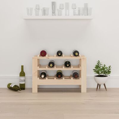 Wooden wine rack with bottles and a small plant nearby