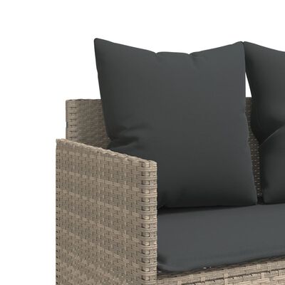 Close-up of the wicker armrest and weave pattern on the outdoor sofa.
