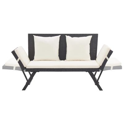 Wicker sofa with cushions and armrests extended on sides