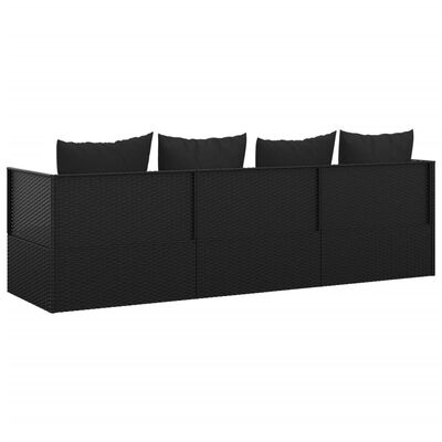 Long dark wicker outdoor sofa with multiple sections and back cushions, side angle view.