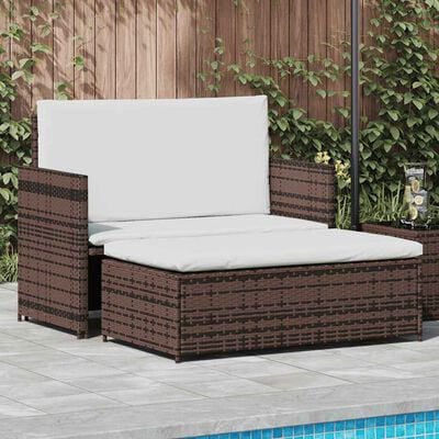 Brown wicker outdoor sofa with white cushions and matching ottoman near poolside.