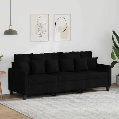 Black modular sofa with multiple seats and decorative cushions in living room