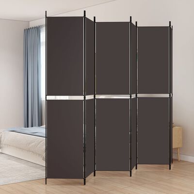 A folding room divider with four panels in a room, dark panels and metal frame