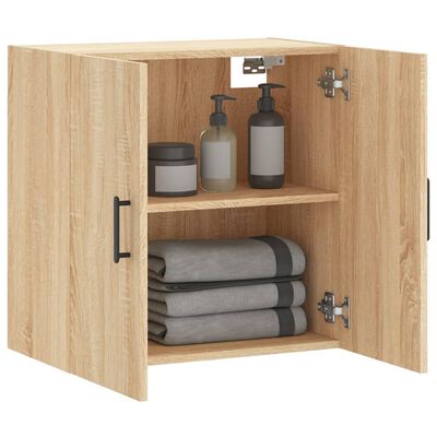 Open wooden cabinet interior with shelves and bathroom items