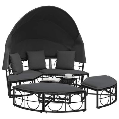 Round outdoor daybed with canopy and cushions, plus matching ottoman and coffee table.