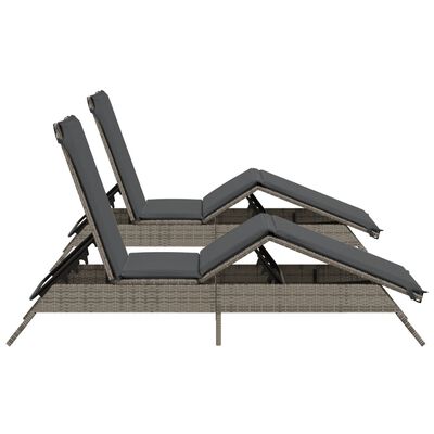 Side view of two reclining lounge chairs with footrests extended.