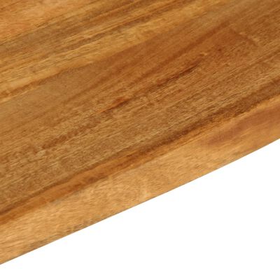 Close-up of the wooden surface of a cutting board showing grain patterns.