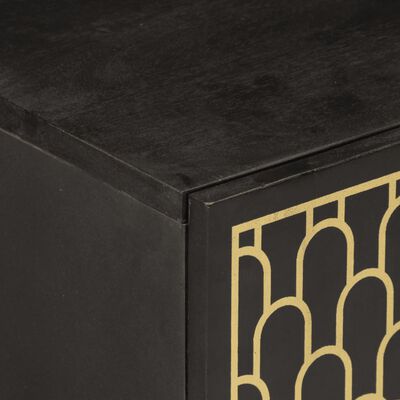 Close-up of the top edge of a black cabinet showing a gold patterned frame.