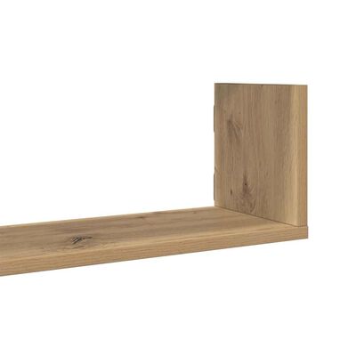Close-up of a wooden shelf plank with a vertical back panel attached, showing joinery.