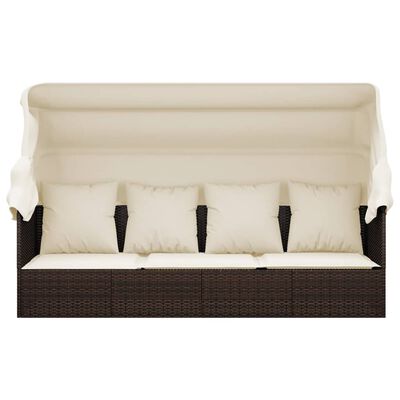 Wicker outdoor sofa with five beige cushions and a canopy.
