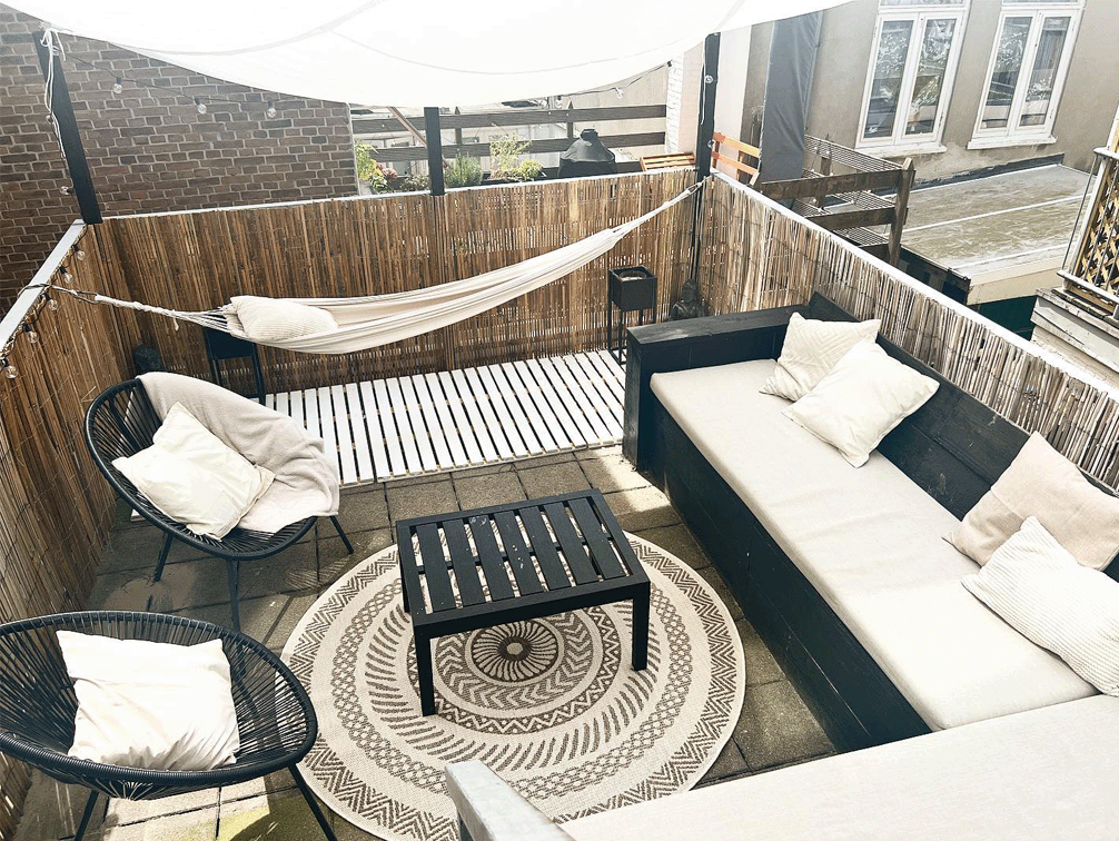 Rooftop lounge with string lights